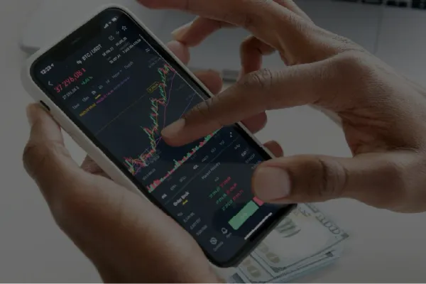Closeup of someone using a smart phone to look at a stock chart