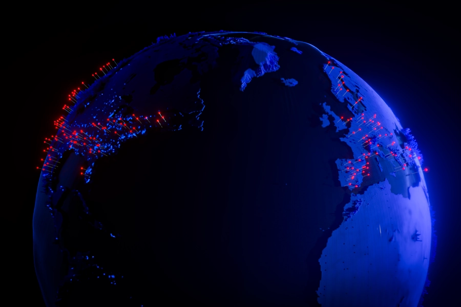 Stylized blue planet earth, white pins with glowing red heads are scattered over North America and Europe